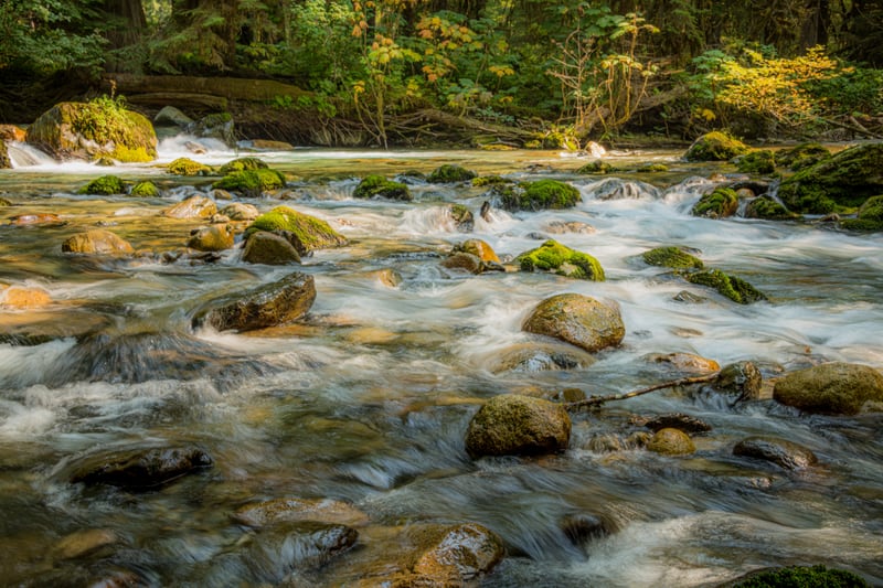 Water Flowing over Rocks by Khalogram Creative