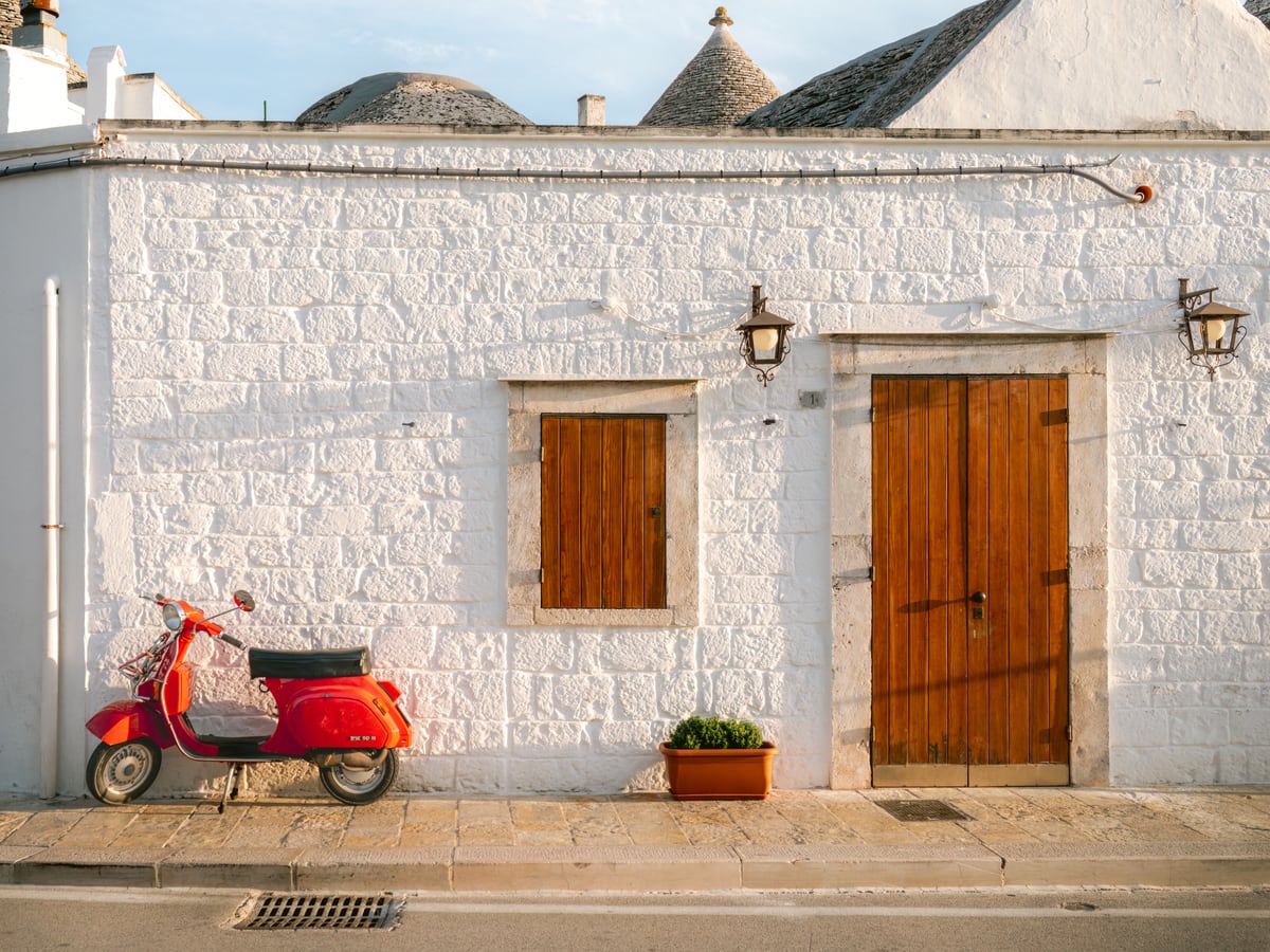 Iconic Red Vespa in an Italian Setting by Marika Huisman