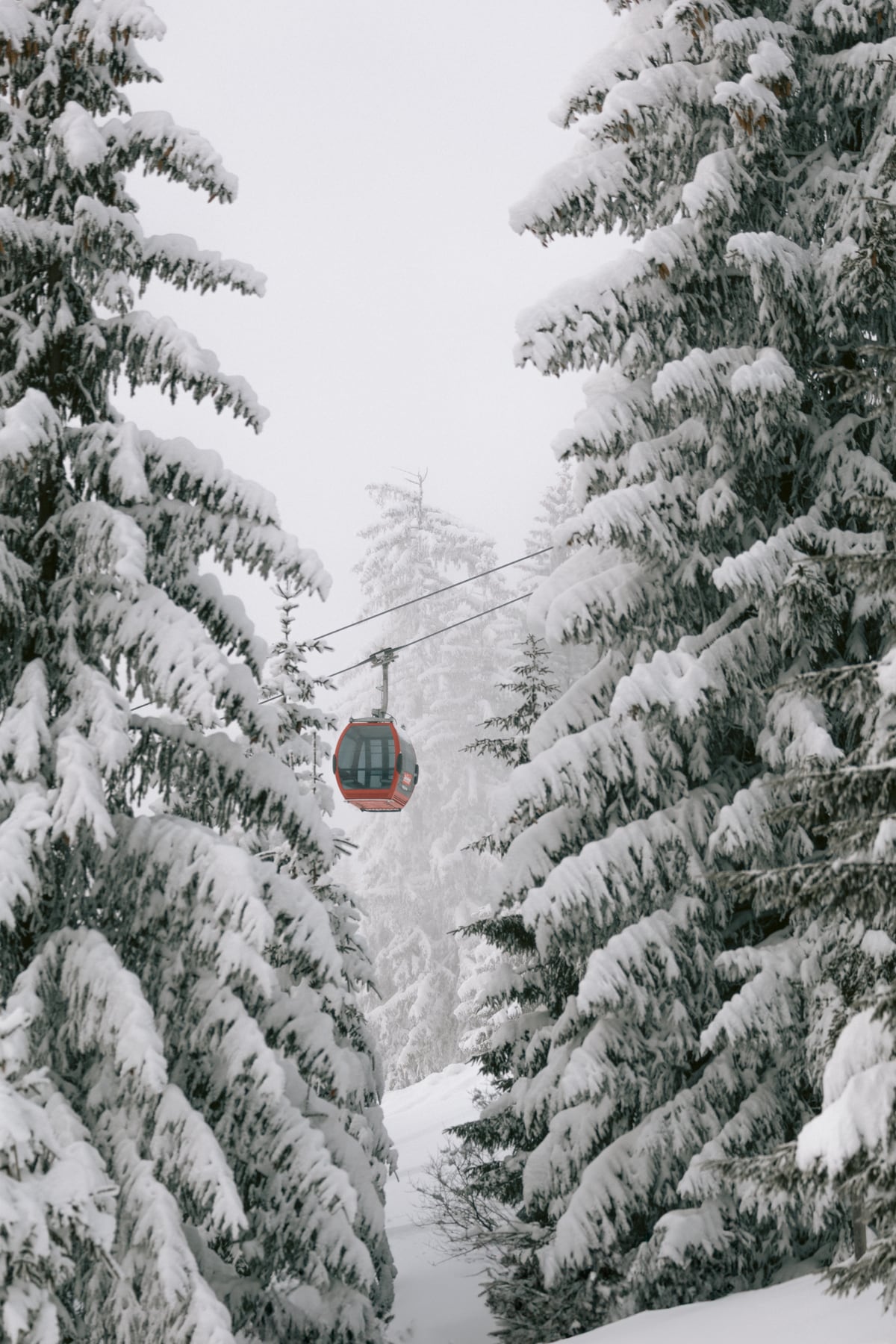 Red gondola at winter landscape | Winter nature photography | Austria by Marika Huisman
