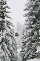 Red gondola at winter landscape | Winter nature photography | Austria by Marika Huisman thumbnail