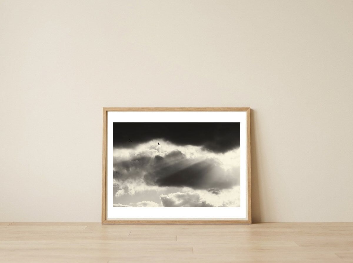 Two — framed, leaning against the wall