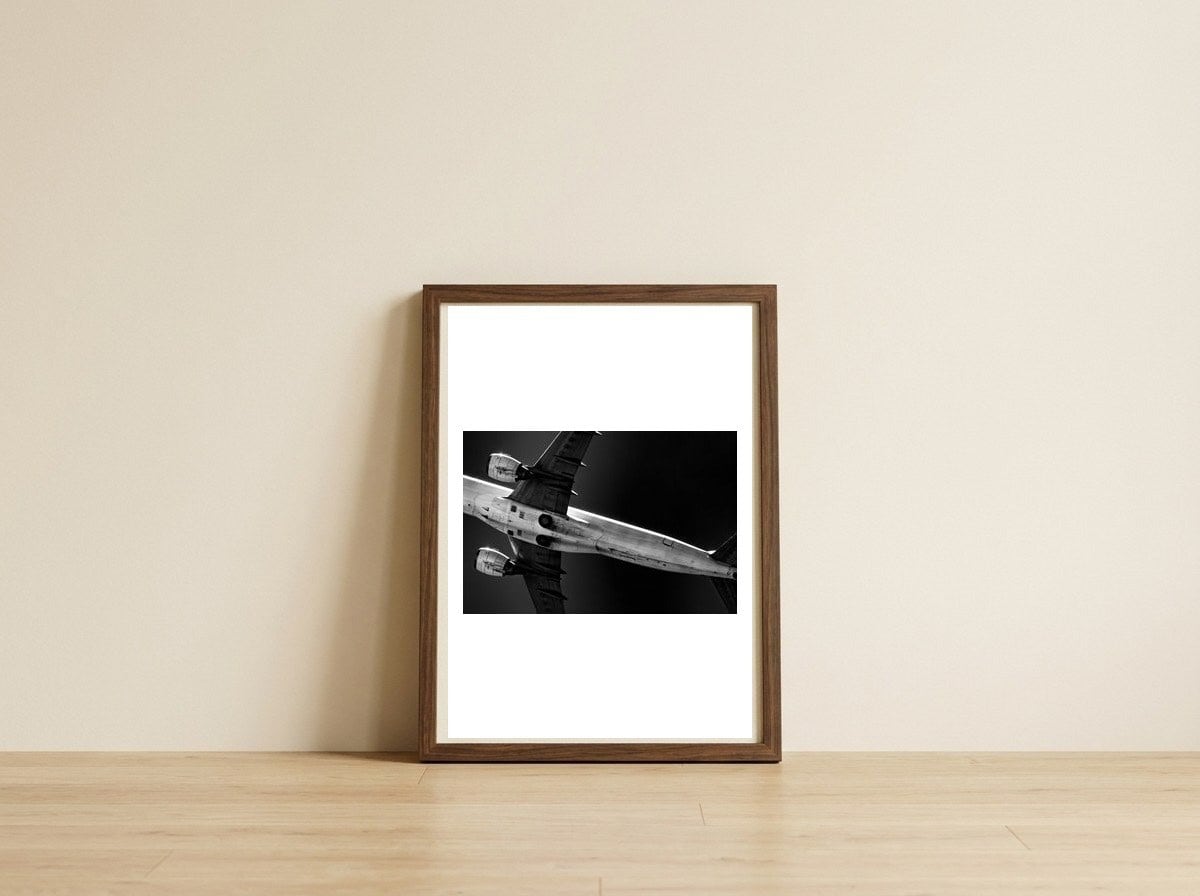 Overhead — framed, leaning against the wall