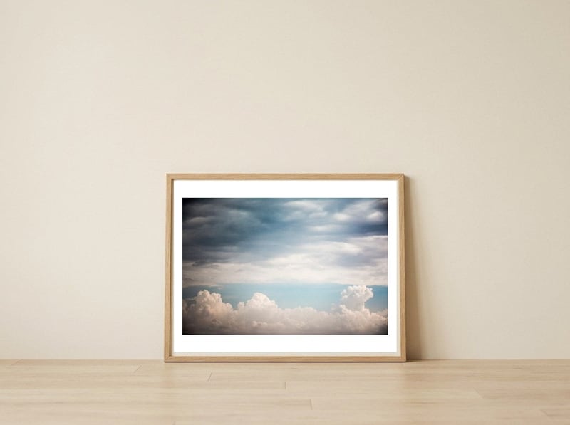 Autumn Clouds — framed, leaning against the wall