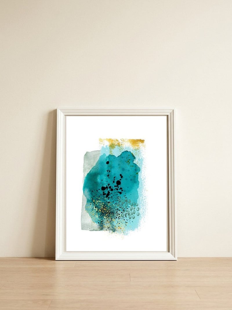 Abstract watercolour turquoise and gold — framed, leaning against the wall