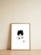 Above cat — framed, leaning against the wall thumbnail
