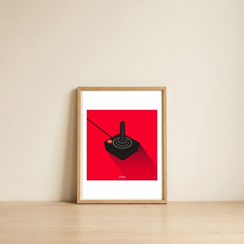 Joystick Videogames Atari — framed, leaning against the wall