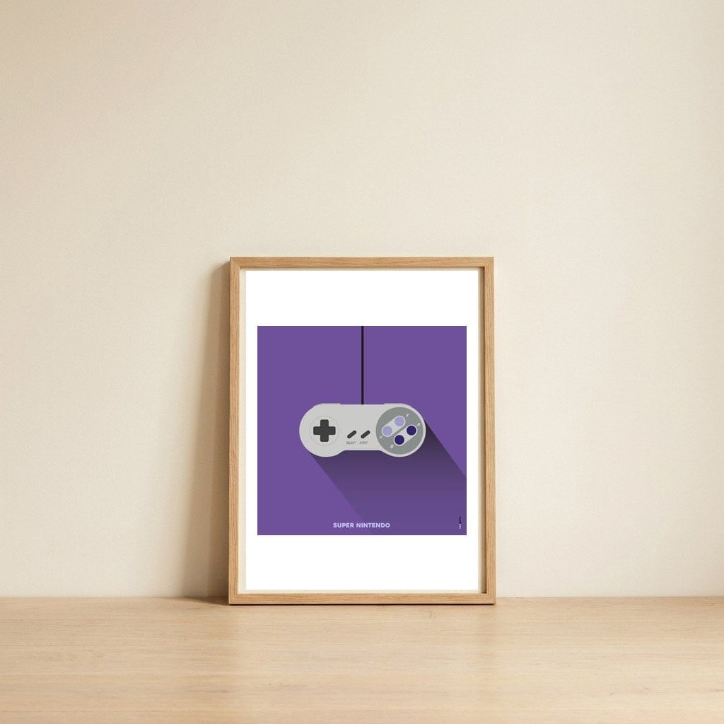 Joystick Videogames Super Nintendo — framed, leaning against the wall