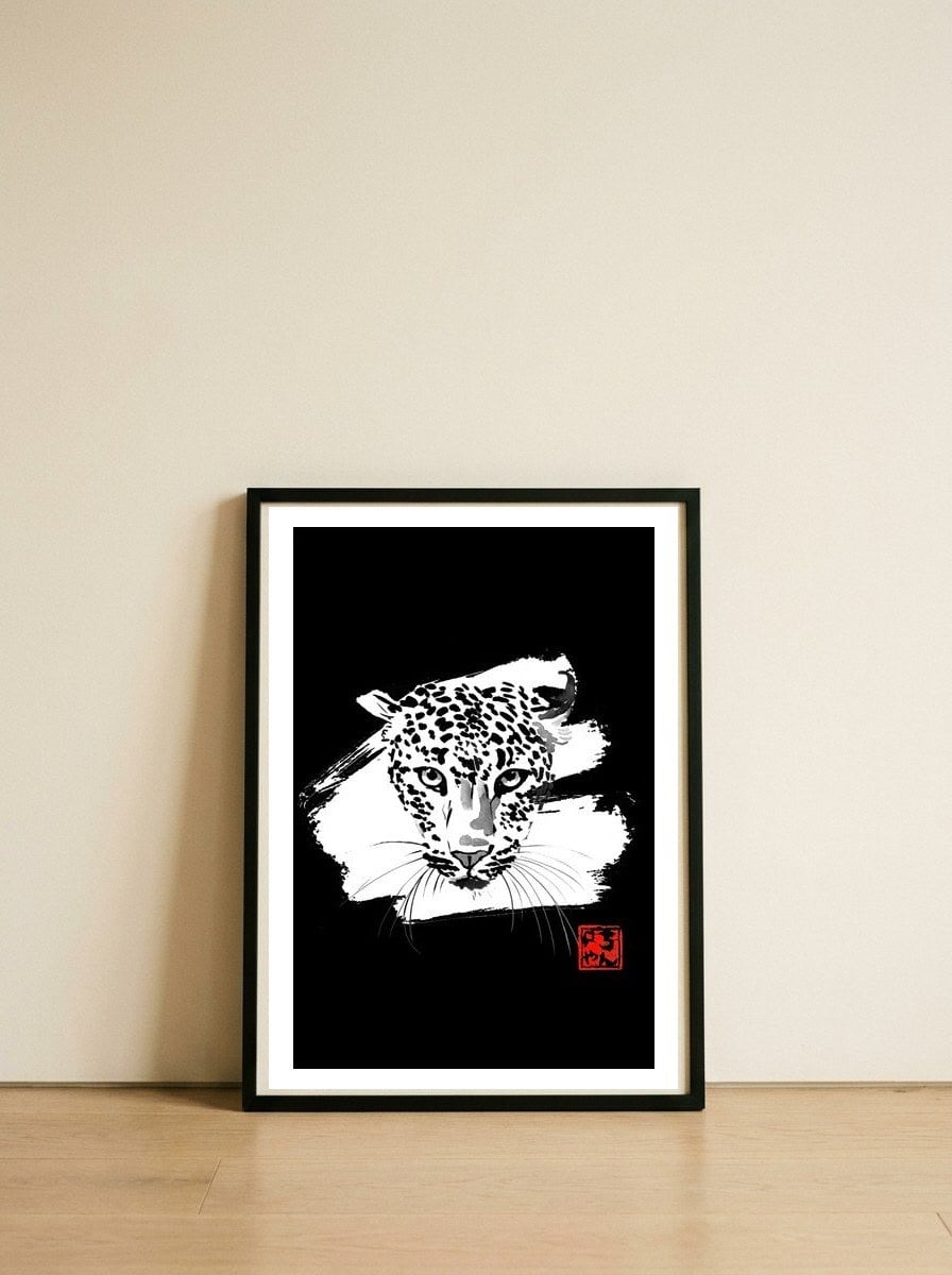 Leopard in white — framed, leaning against the wall