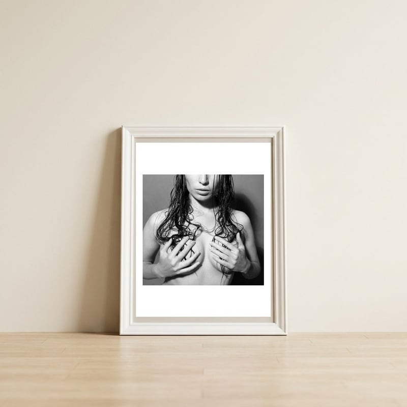 Nude body — framed, leaning against the wall
