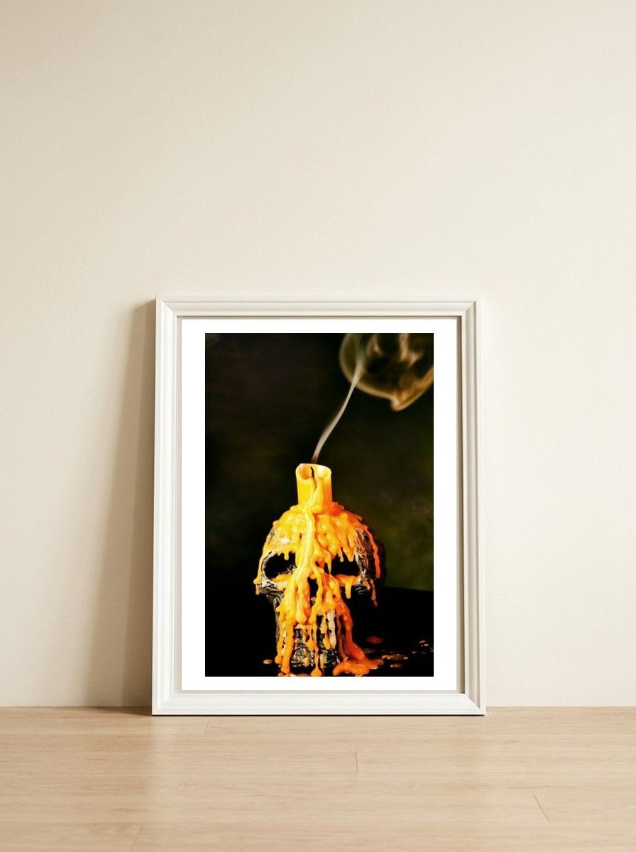 Spooky skull — framed, leaning against the wall