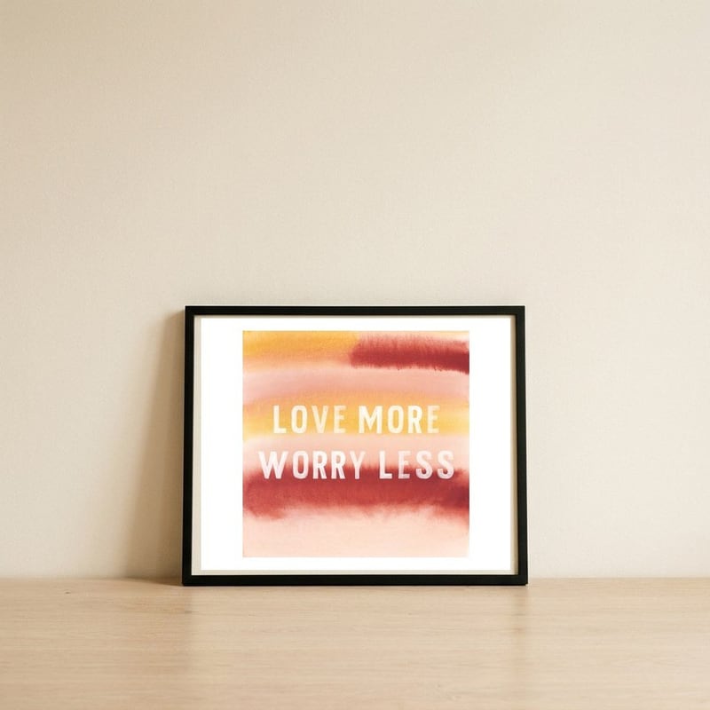 Love More — framed, leaning against the wall
