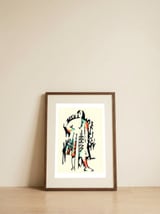 Turn to the left — framed, leaning against the wall thumbnail