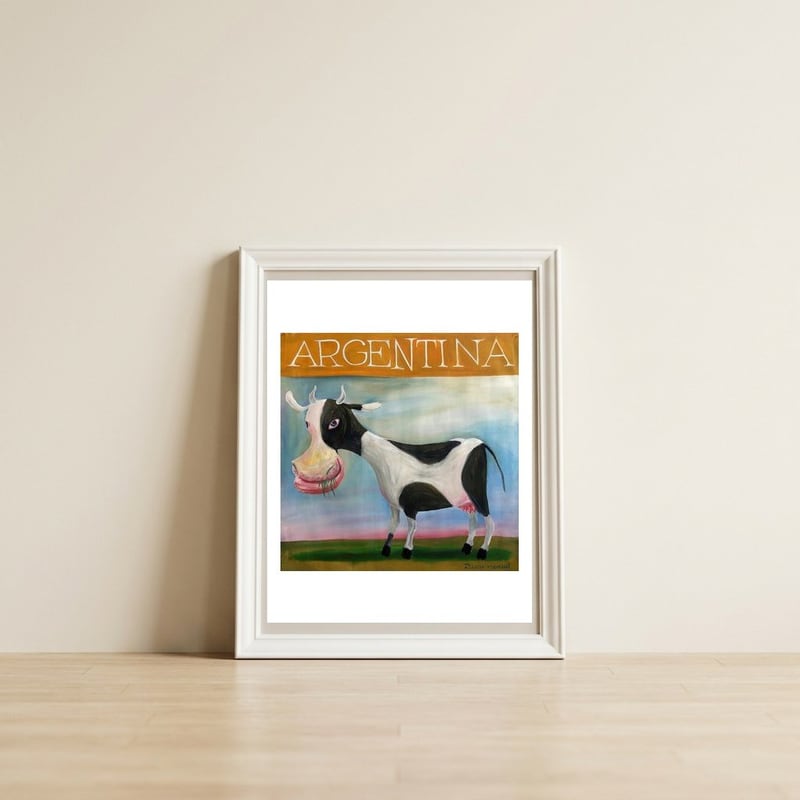 Vaca Argentina — framed, leaning against the wall
