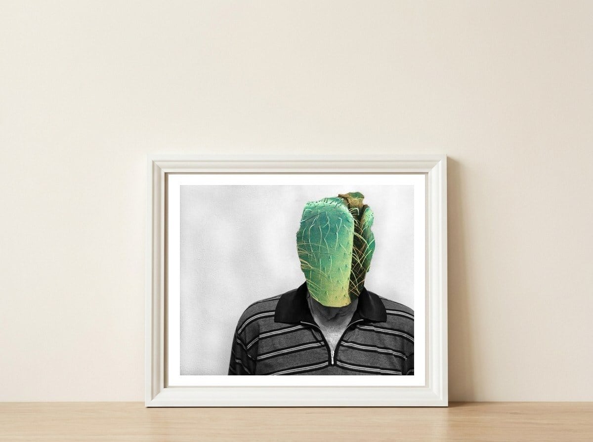 Masked — framed, leaning against the wall
