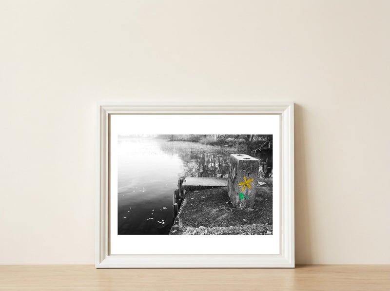 Frozen Ground Yellow Flower Street Art — framed, leaning against the wall