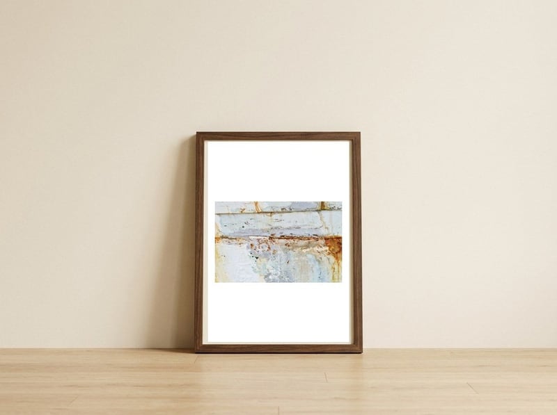 April — framed, leaning against the wall