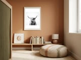 portrait of a highland cow framed in a gentle room thumbnail