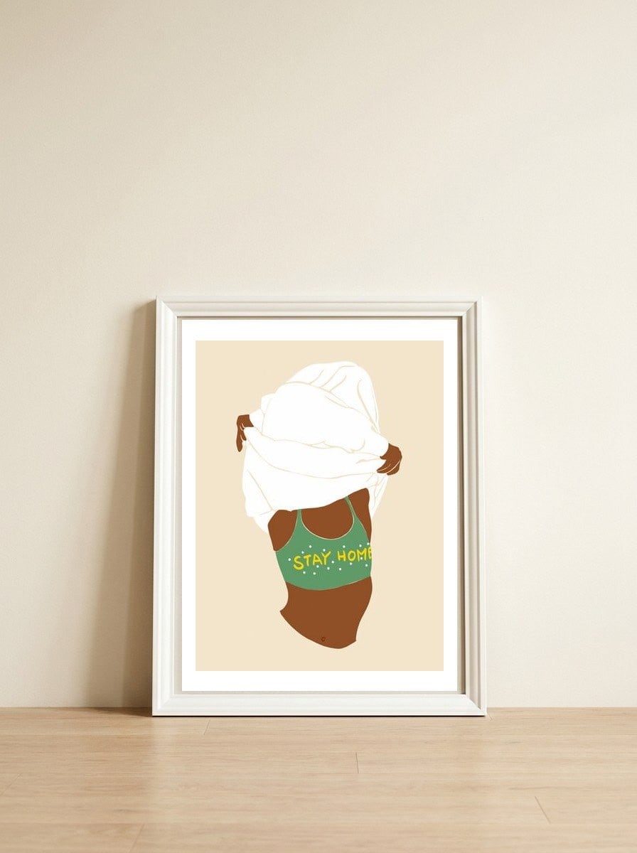 Stay Home — framed, leaning against the wall