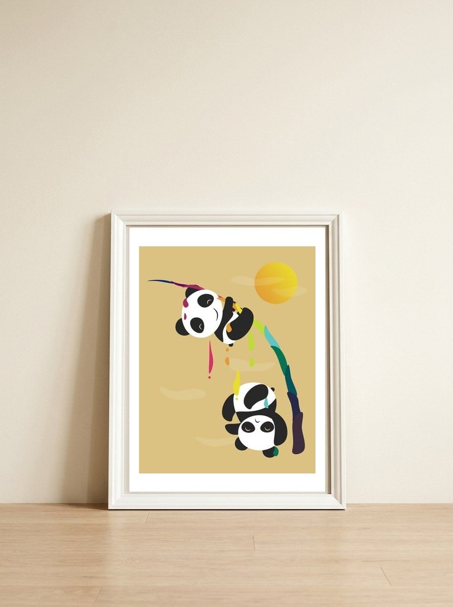 Pandas meet a strange rainbow — framed, leaning against the wall