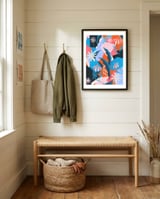 Blue, orange and pink framed in a relaxed room thumbnail