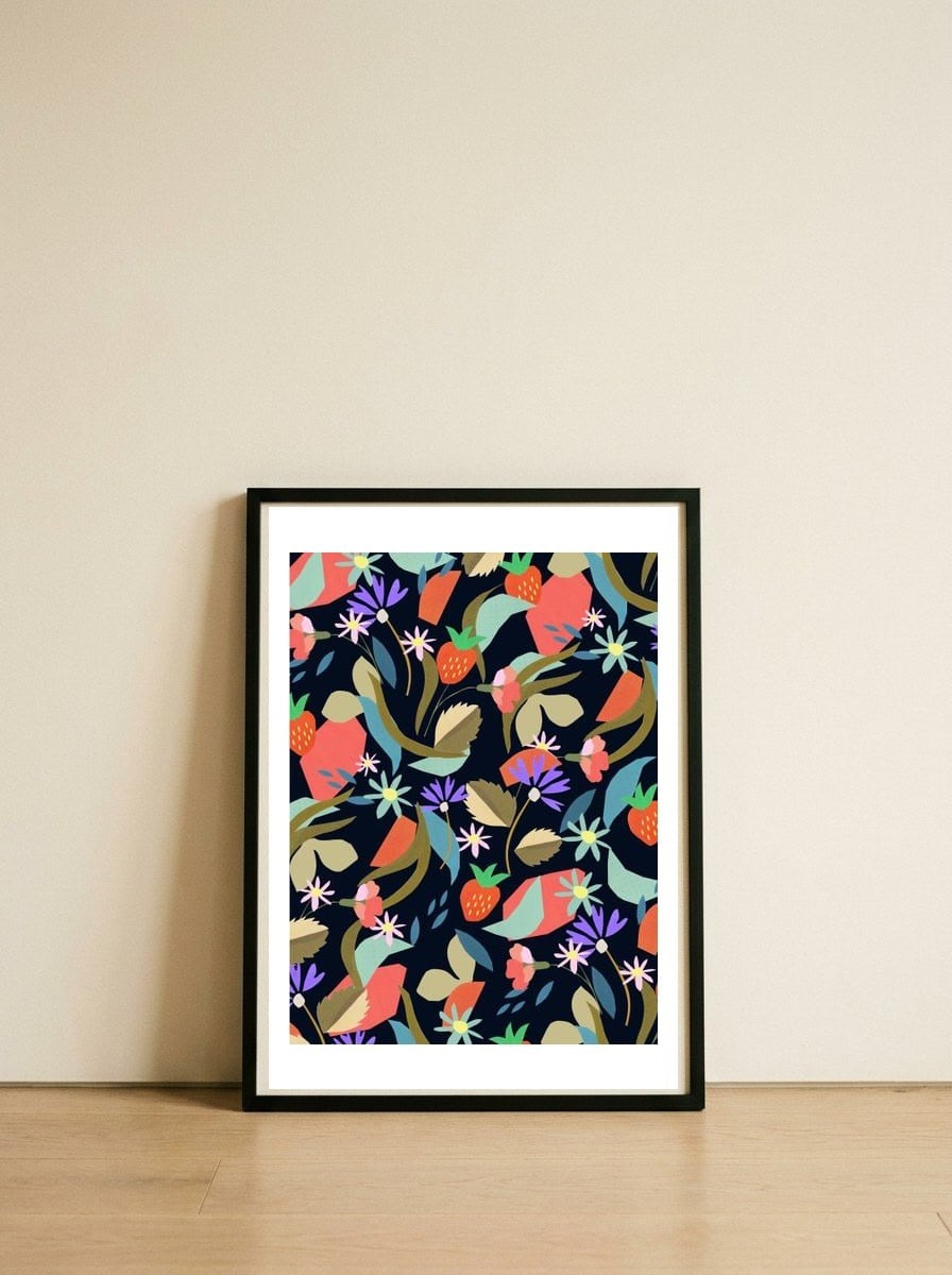 strawberry flower — framed, leaning against the wall