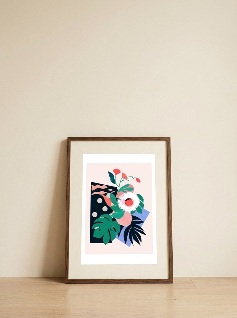 Pink flower — framed, leaning against the wall