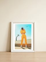 The Girl In Yellow Joggers — framed, leaning against the wall thumbnail