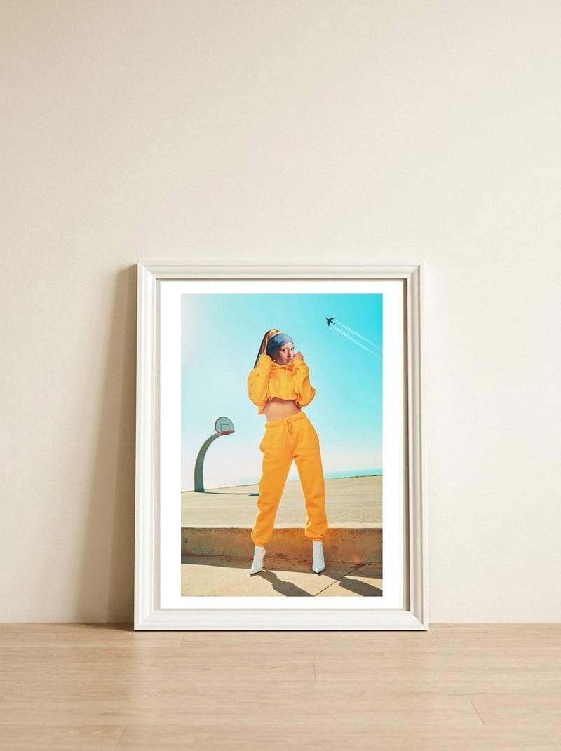 The Girl In Yellow Joggers — framed, leaning against the wall