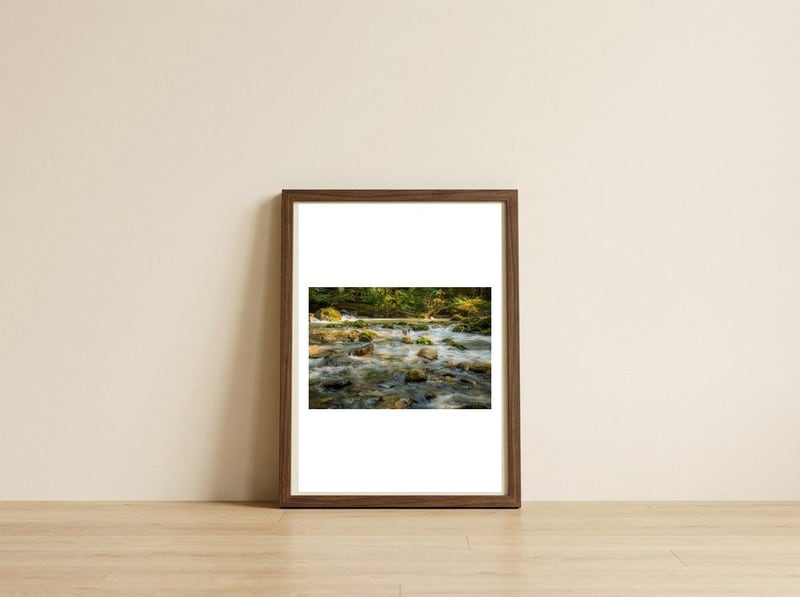 Water Flowing over Rocks — framed, leaning against the wall