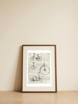 Bicycles  — framed, leaning against the wall thumbnail