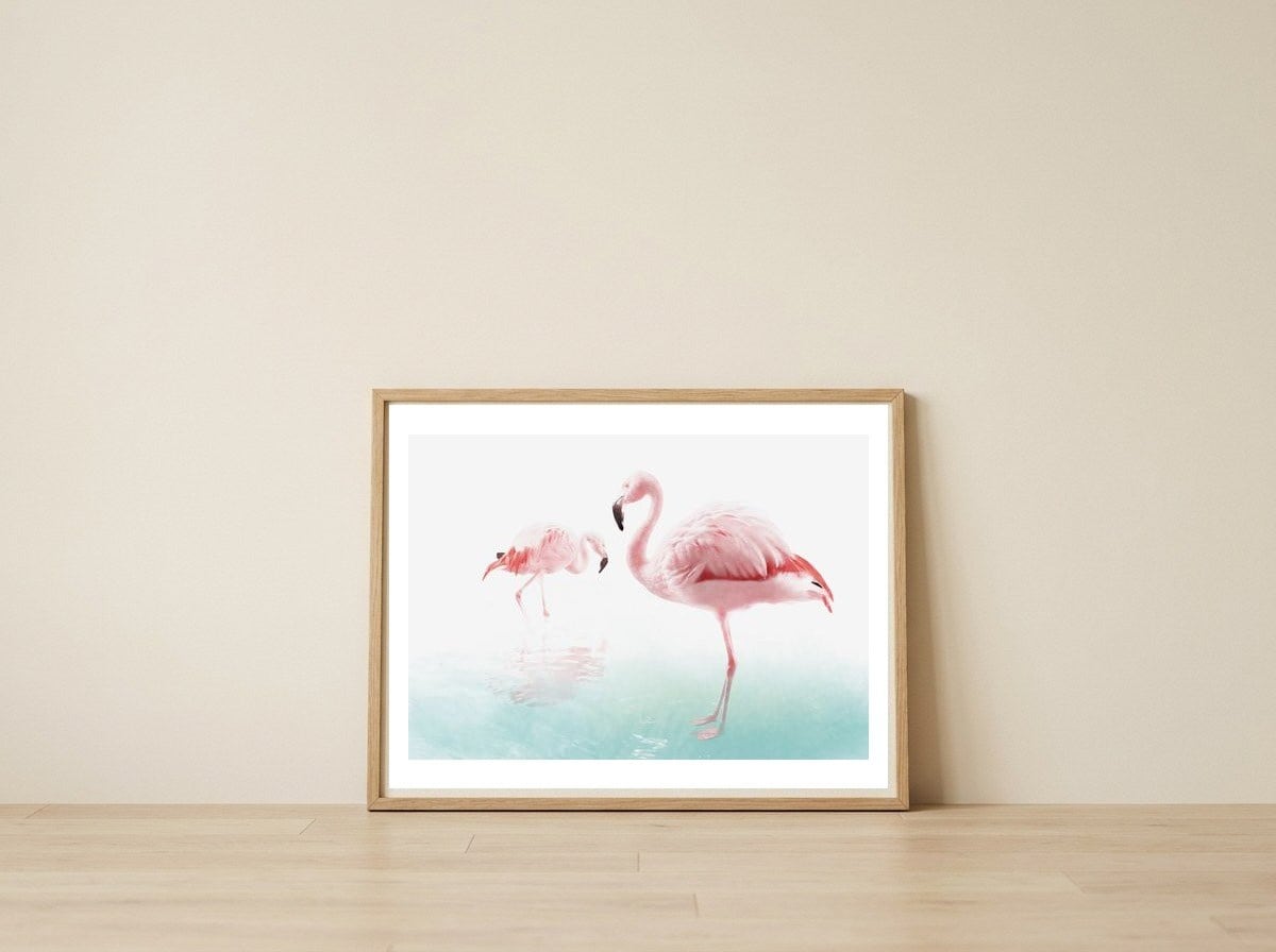 Flamingos — framed, leaning against the wall