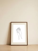 holding hands — framed, leaning against the wall thumbnail