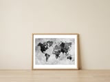 black and white world map — framed, leaning against the wall thumbnail