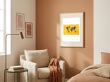 world map yellow art framed in a tender room thumbnail