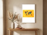 world map yellow art framed in a welcoming room thumbnail