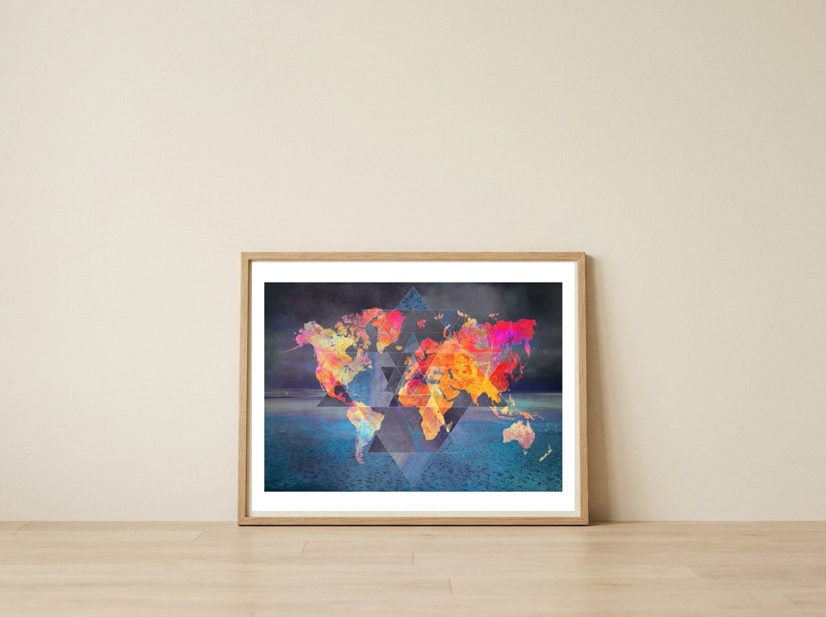 World Map triangle — framed, leaning against the wall