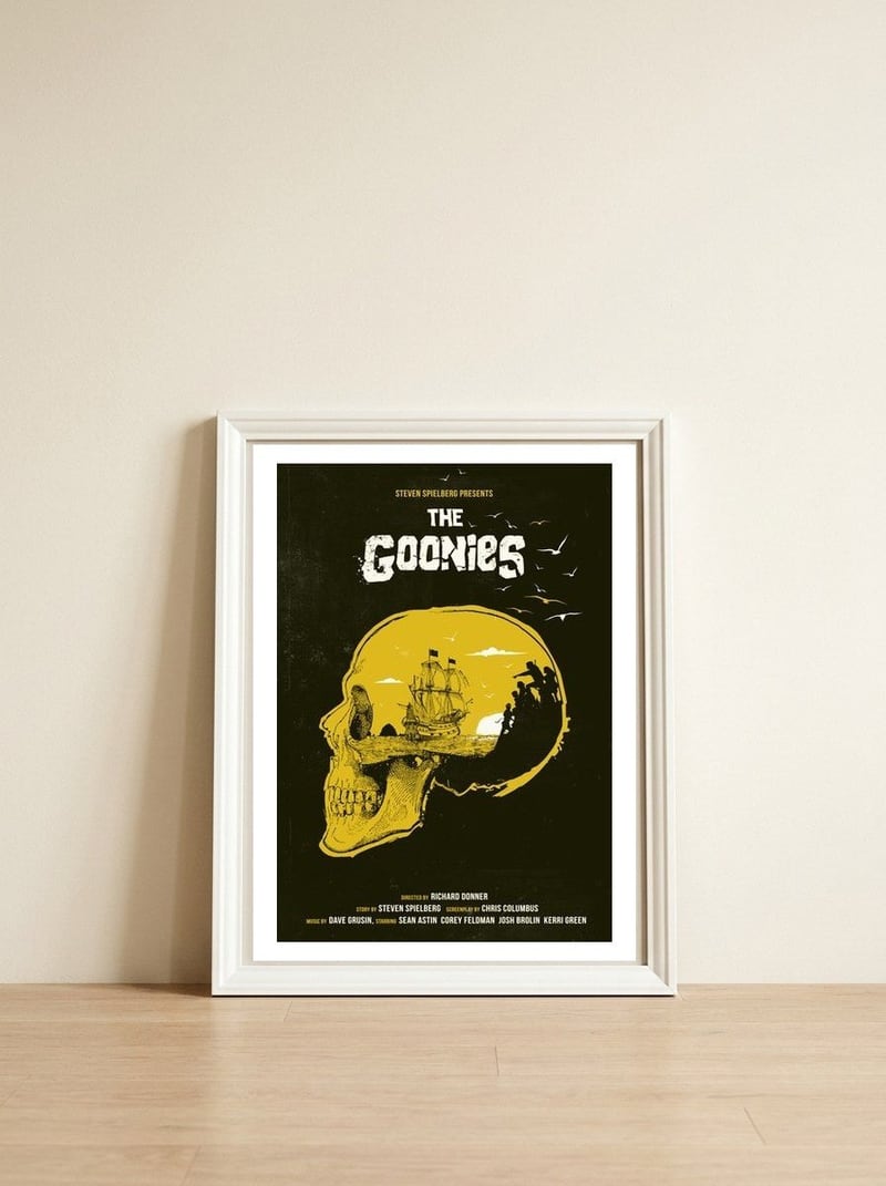 The Goonies movie poster — framed, leaning against the wall