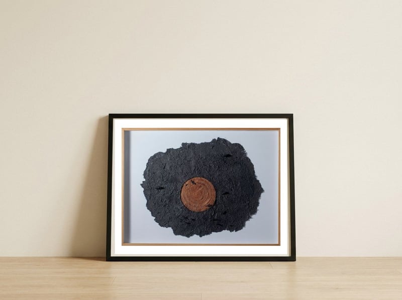 Ecotraces — framed, leaning against the wall