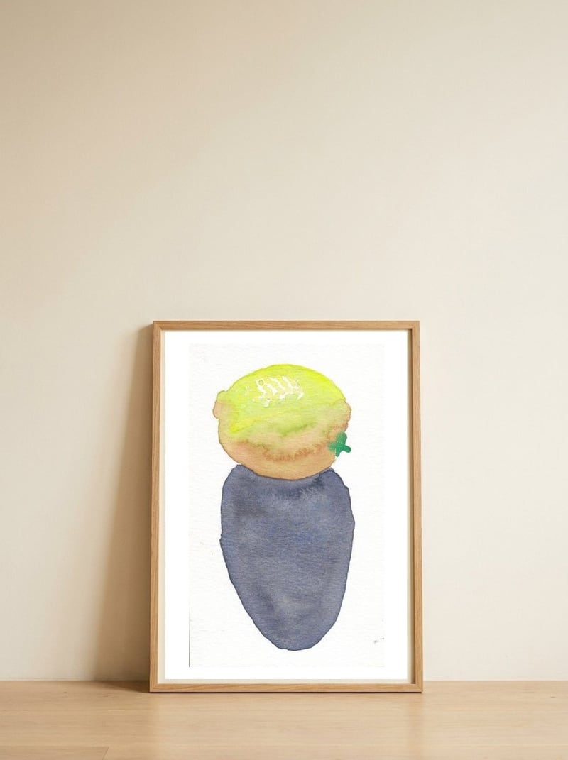 Lemon — framed, leaning against the wall
