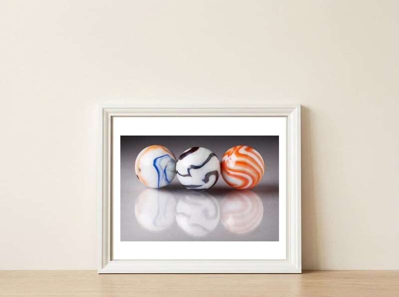 Marbles — framed, leaning against the wall