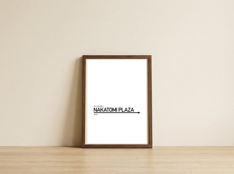 TO NAKATOMI PLAZA — framed, leaning against the wall