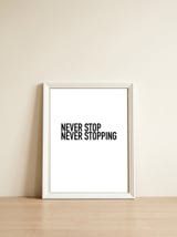 NEVER STOP — framed, leaning against the wall thumbnail