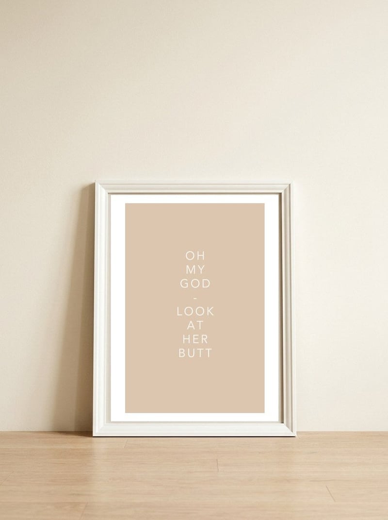 HER BUTT — framed, leaning against the wall