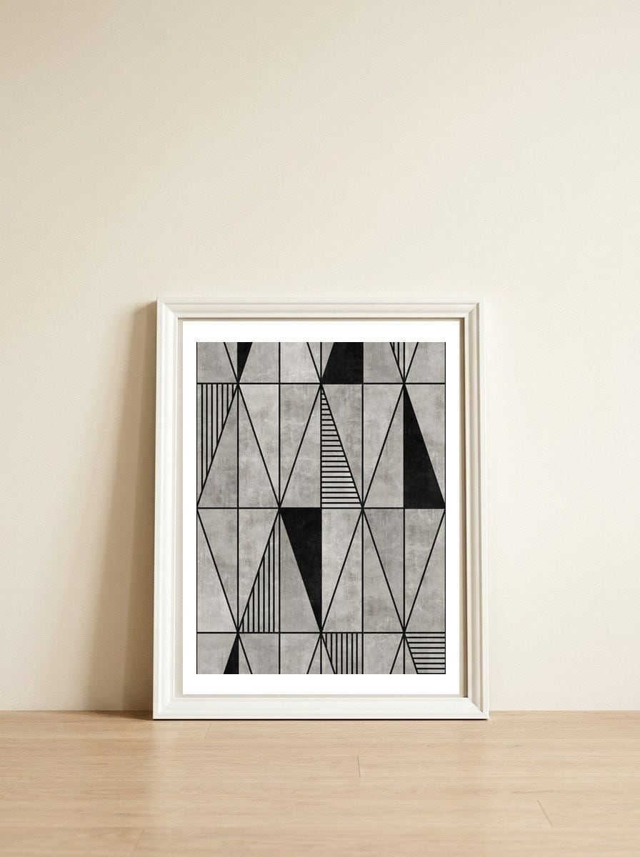Concrete Triangles — framed, leaning against the wall