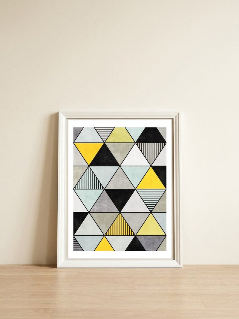 Colorful Concrete Triangles 2 - Yellow, Blue, Grey — framed, leaning against the wall