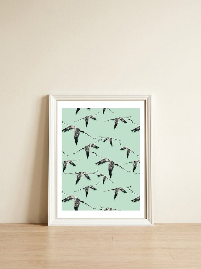 Flight of flamingos — framed, leaning against the wall
