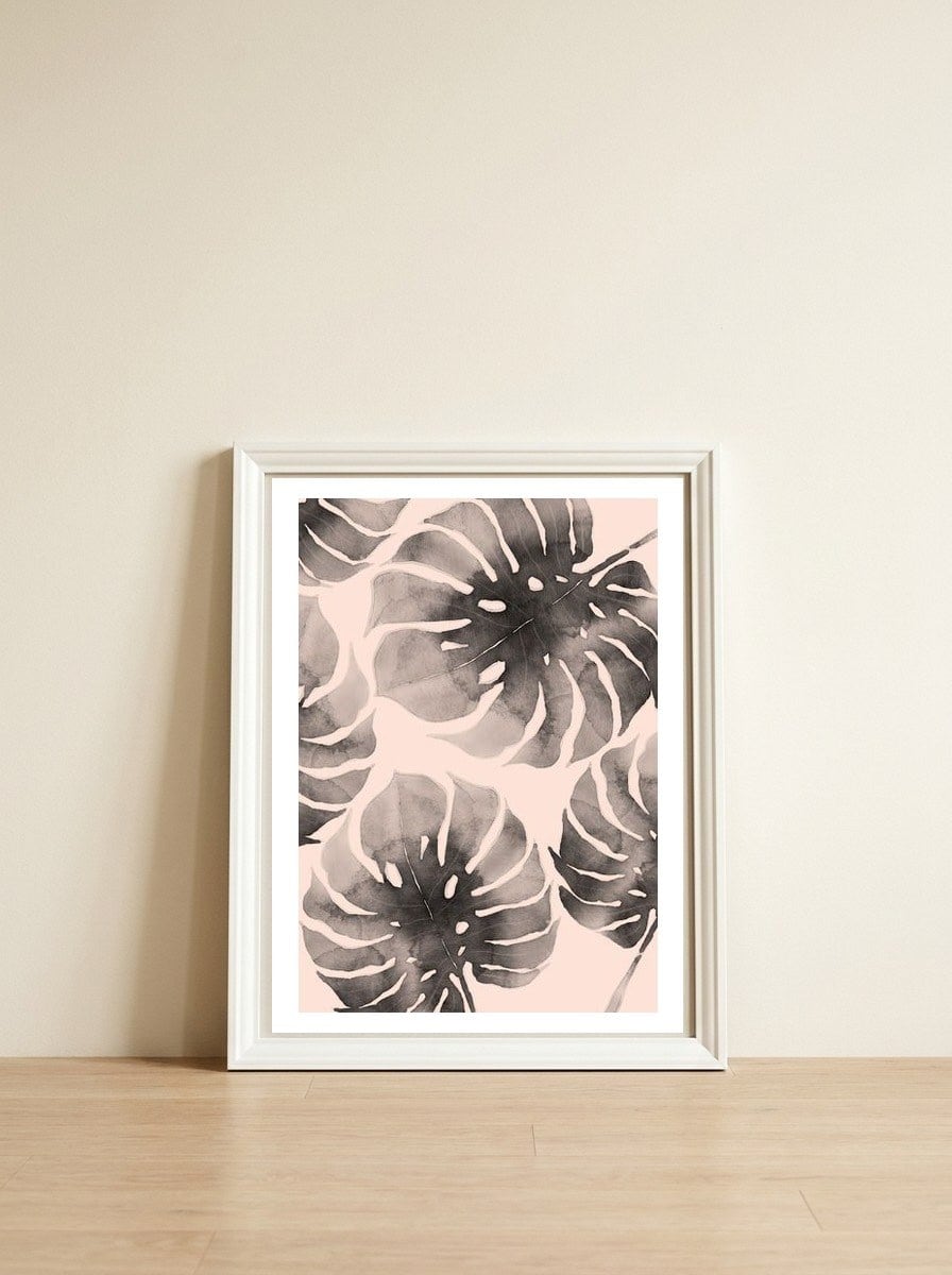Monstera pink and gray watercolor — framed, leaning against the wall