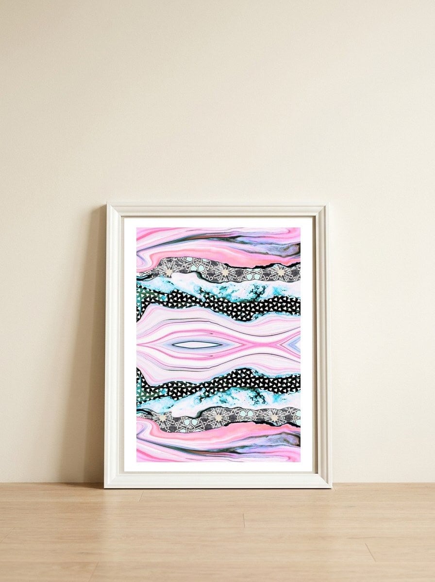 Abstract shapes of marble and patterns — framed, leaning against the wall
