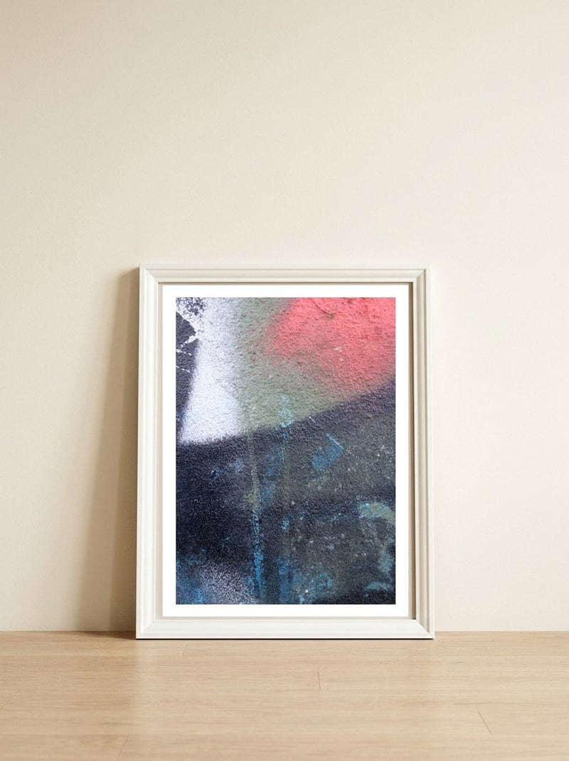 Up — framed, leaning against the wall