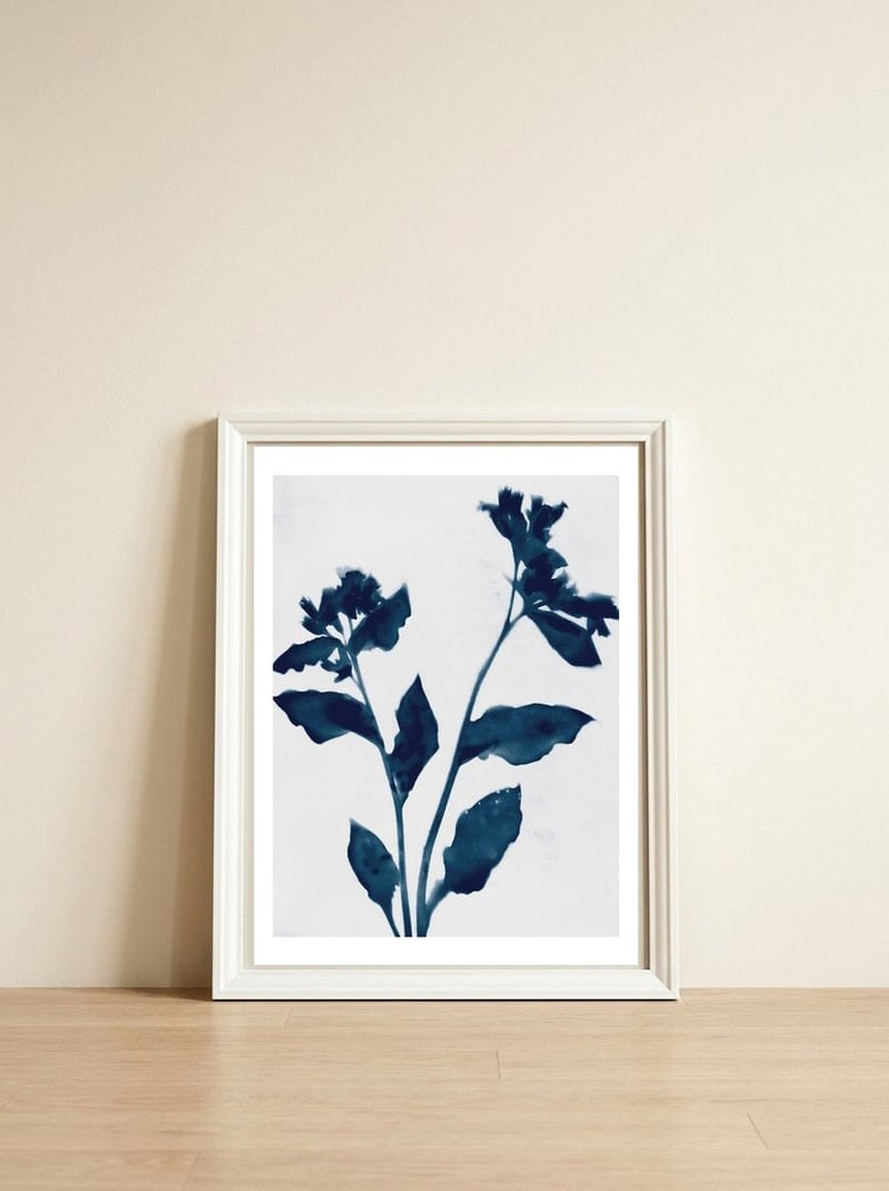 Indigo Blue Flower Silhouette 2 — framed, leaning against the wall